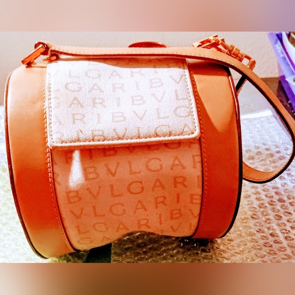 Bvlgari Handbags - Bvlgari B-Zeto I Tan/Cream Logomania Cylinderical Made in Italy RV EAET Purse .